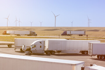 Truck parking with trucks and wind turbines