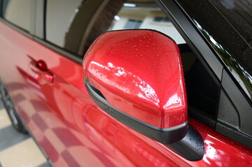 wing mirror of red car, transpotation industry