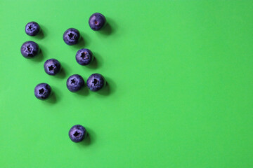 blueberries on green background