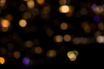 Black and yellow bokeh abstract light background. Artistic style - Defocused urban abstract texture...