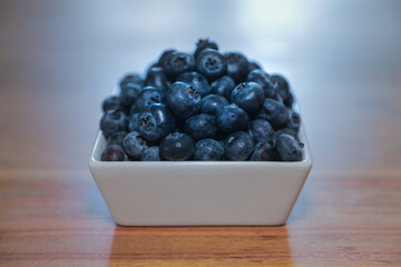Close up detail of blueberries in square dish