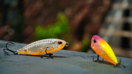 Artificial lure made from plastic for fishing by casting. Selected focus of casting lure with hook - Artificial lure with the shape of minnow