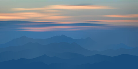 Fototapeta premium Sunset in the mountains, peaks in the haze, clouds