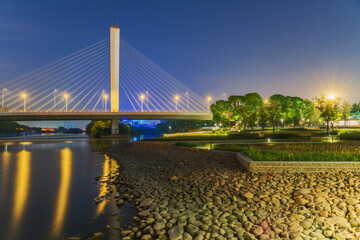Scenery of Modern Urban Skyline and Canal Cable stayed Bridge and Canal Park in Jiangyin, China