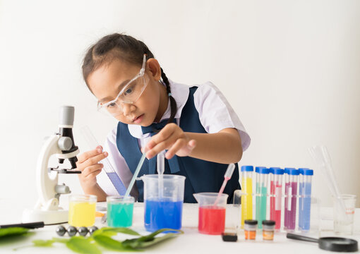 Asian schoolgirl uniform with science experiment, Girl is working education concept.