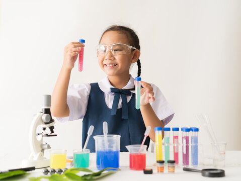 Asian schoolgirl uniform with science experiment, Girl is working education concept.