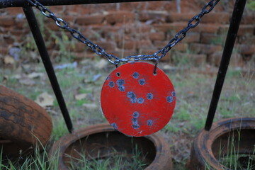 Close up of a shooting target and bullseye with bullet holes