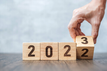 hand flip 2022 to 2023 block. goal, Resolution, strategy, plan,, motivation, reboot, forecast, change, countdown and New Year holiday concepts