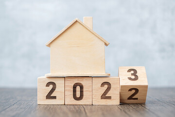 flip 2022 to 2023 block with house model. real estate, Home loan, tax, investment, financial,...