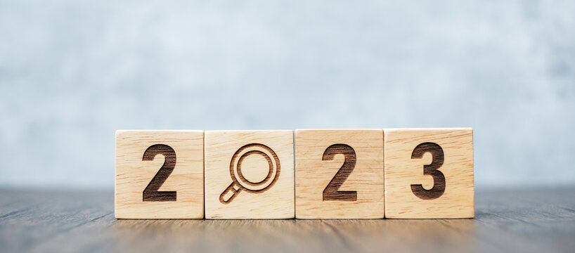 2023 block with magnifying glass icon. SEO, Search Engine Optimization, hiring , Advertising, Idea, Strategy, marketing, Keyword, Content and New Year start concepts