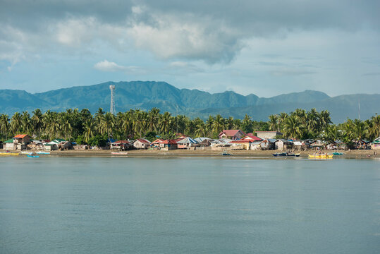 Late afternoon by the coast and beach of Bato, Leyte with mountains at the background.