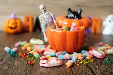 Happy Halloween day with ghost candies, candle, pumpkin, Jack O lantern and decorative (selective...