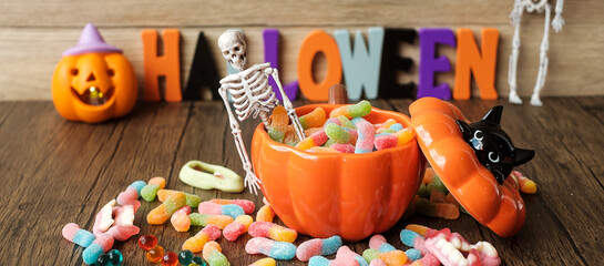 Happy Halloween day with ghost candies, pumpkin bowl, Jack O lantern and decorative (selective focus). Trick or Threat, Hello October, fall autumn, Festive, party and holiday concept