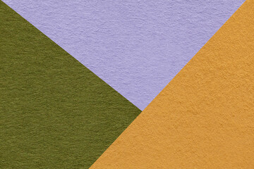 Fototapeta premium Texture of craft yellow, green and lilac shade color paper background, macro. Vintage abstract cardboard
