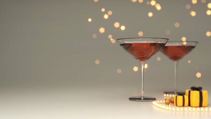 Realistic Cocktail Glasses With Gift Boxes, Baubles, Lighting Garland And Copy Space On Gray Bokeh Background.
