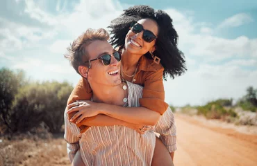 Abwaschbare Fototapete Arizona Love, happy and couple piggy back on road path in Arizona desert in USA for romantic getaway. Interracial people dating smile while enjoying summer romance on travel holiday adventure together.