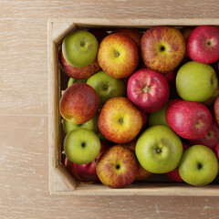 Mixed variety of apples in a crate view from above