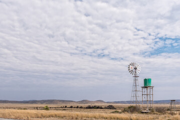 Water-pumping windmill and water tank on farm near Hanover