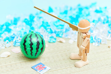 砂浜ですいか割り