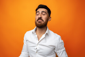 Portrait of handsome smiling businessman on studio background