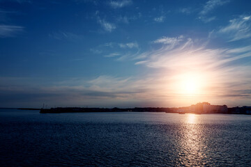 Silhouette of Galway city at sunset. Blue and warm tone. Nimmo's Pier and the Long Walk area.