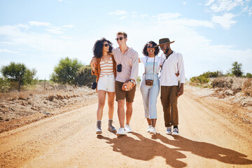 Travel, adventure and friends walk on road path together to explore the Arizona desert in the USA....