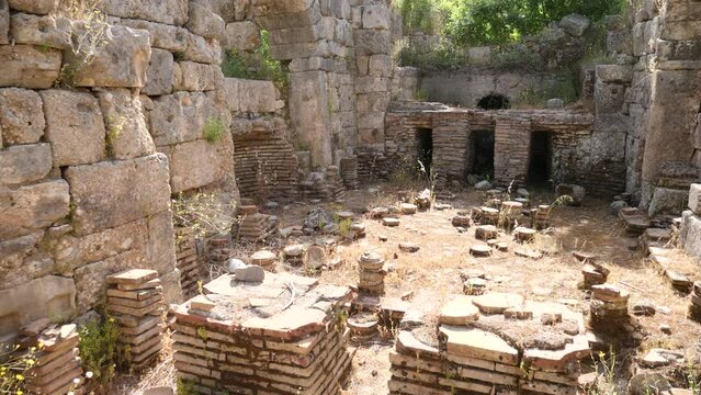 Ruins of Southern Baths of Perge. Stone columns and walls of ancient city.