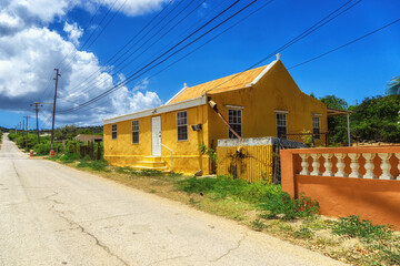 Fototapeta na wymiar A small yellow house in Rincon Bonaire Netherlands Antilles