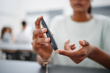 Diabetes, finger and black woman with blood sugar test on to check levels of student while sitting at desk. Healthcare, health and female prick to use glucose meter for insulin and wellness - obrazy, fototapety, plakaty