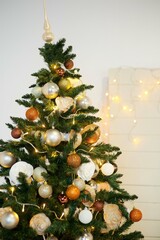 Elegant decorated with balls and figures Christmas tree with a beautiful design.