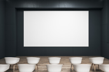 Front view on blank white wall board with space for your logo or text on black wall in empty auditorium with white seats on wooden floor. 3D rendering, mockup