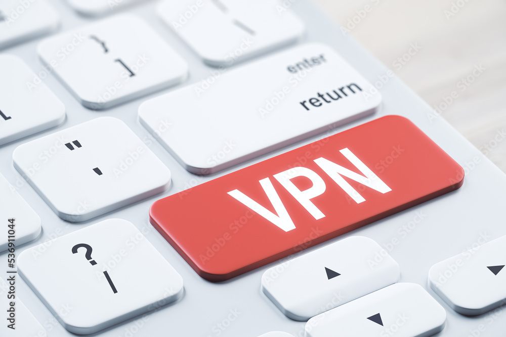 Poster Close up of red vpn button on white keyboard placed on blurry wooden desktop. concept. 3D Rendering.