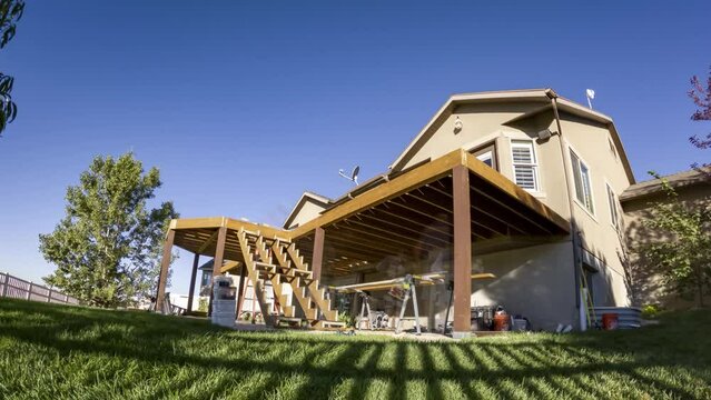 Construction time lapse of a home deck remodel with the stairs being installed