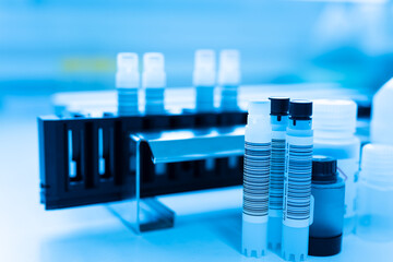 Reagent tubes and bottes for laboratory analysis automate machine.Sample specimen in test tube and chemistry and immunology reagent bottle .Conceptual image COVID-19 test tube sample.