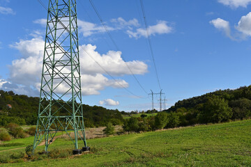 Landscape with pylons for high voltage transmission line in the Czech Republic