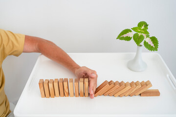 Man playing with toy blocks on coffee table