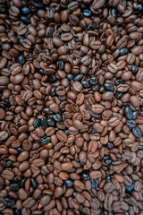 roasted coffee beans, brown background