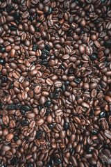roasted coffee beans, brown background