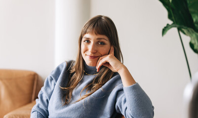 Confident young businesswoman looking at the camera in an office