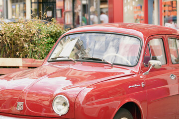 PARIS, FRANCE - MAY, 15, 2022:Vintage red Renault Dauphine