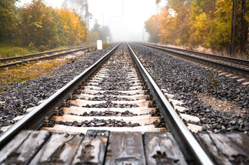 Fototapeta na wymiar Railway tracks in country on the autumn. Train journey.