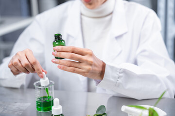 chemistry scientist working on biotechnology cosmetic research with natural herb medicine...