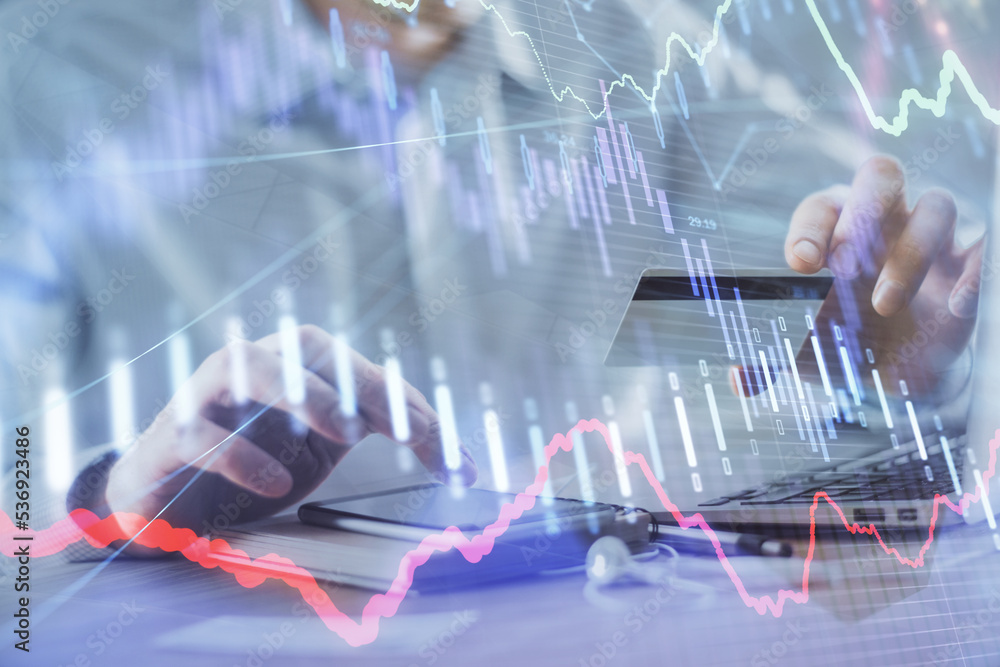 Poster double exposure of man hands holding a credit card and forex graph drawing. stock trading and digita
