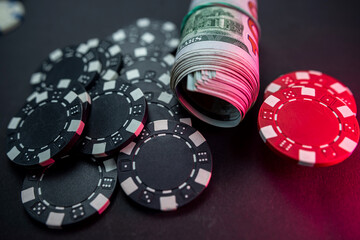 playing cards and chips and dollars are scattered around the new poker table.