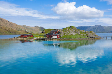 Fishing village with traditional red rorbu at Trollholmen island, Mageroya, Norway