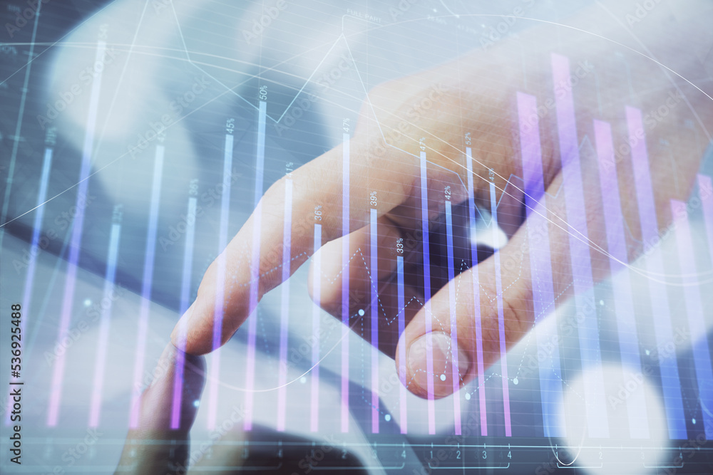 Poster multi exposure of man's hands holding and using a phone and financial chart drawing. market analysis