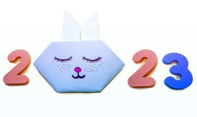 2023 year digits wooden numbers for educational games and origami cute paper rabbit bunny sleeping...