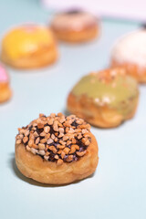 donuts with chocolate studded with peanuts