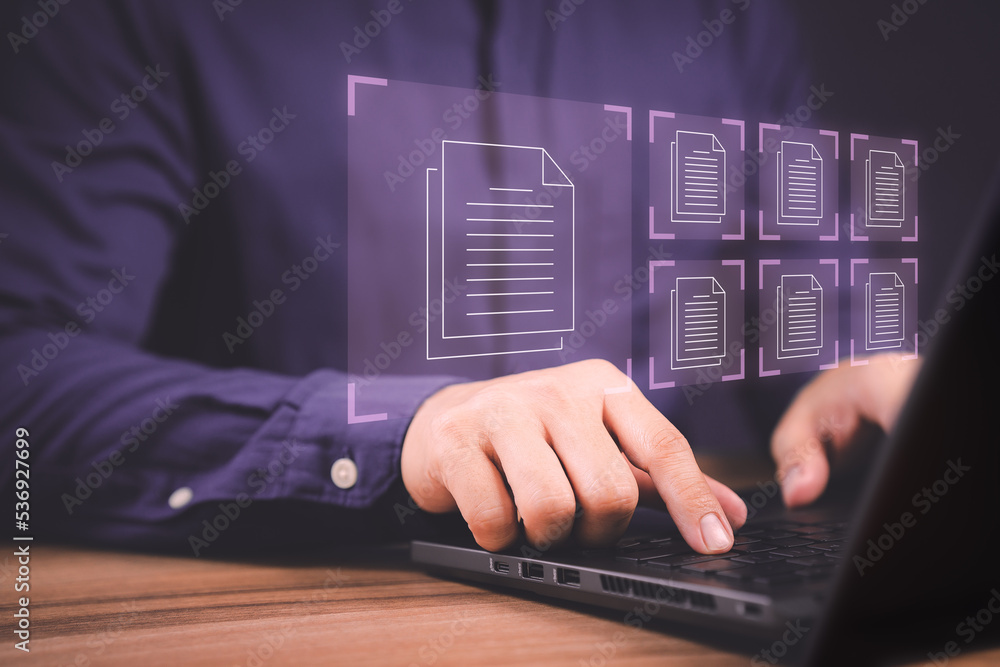 Fototapete Document Management System (DMS), online documentation database and process automation to efficiently manage files. Corporate business technology. Employee man using a computer laptop in office.