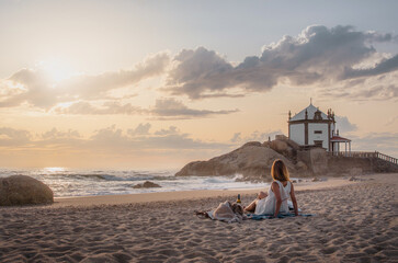 Miramar portugal summer sea sunset. Romantic picnic on the beach. Bottle of wine